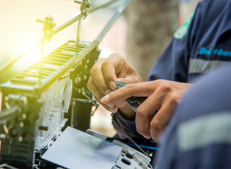 Technicians are install cabinet on fiber optic cable