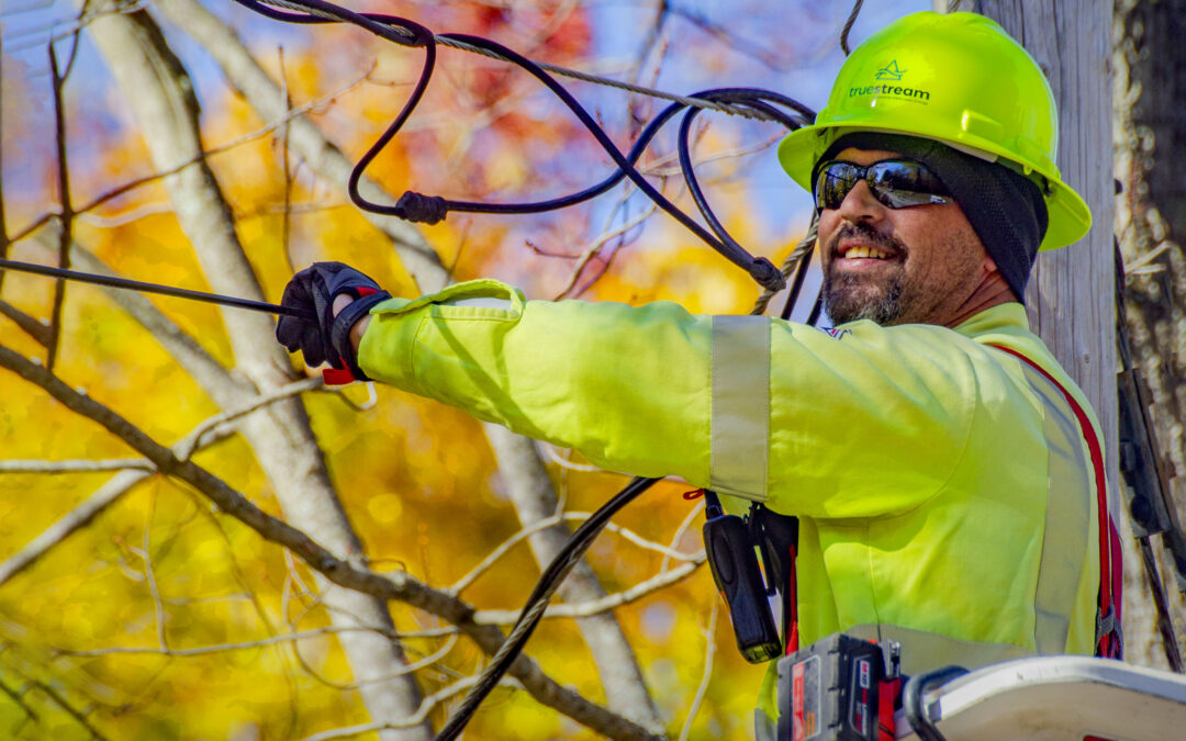 Construction worker installing fiber internet lines